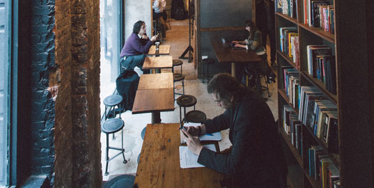 Coffee shop with with business type people setting around
